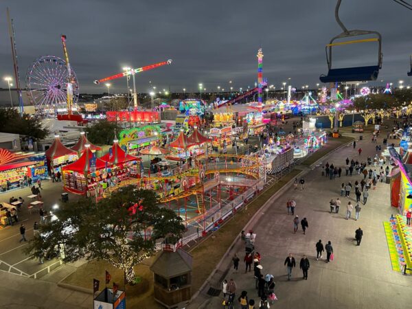 Houston Rodeo Carnival at night, with ski lift ride and ferris wheels