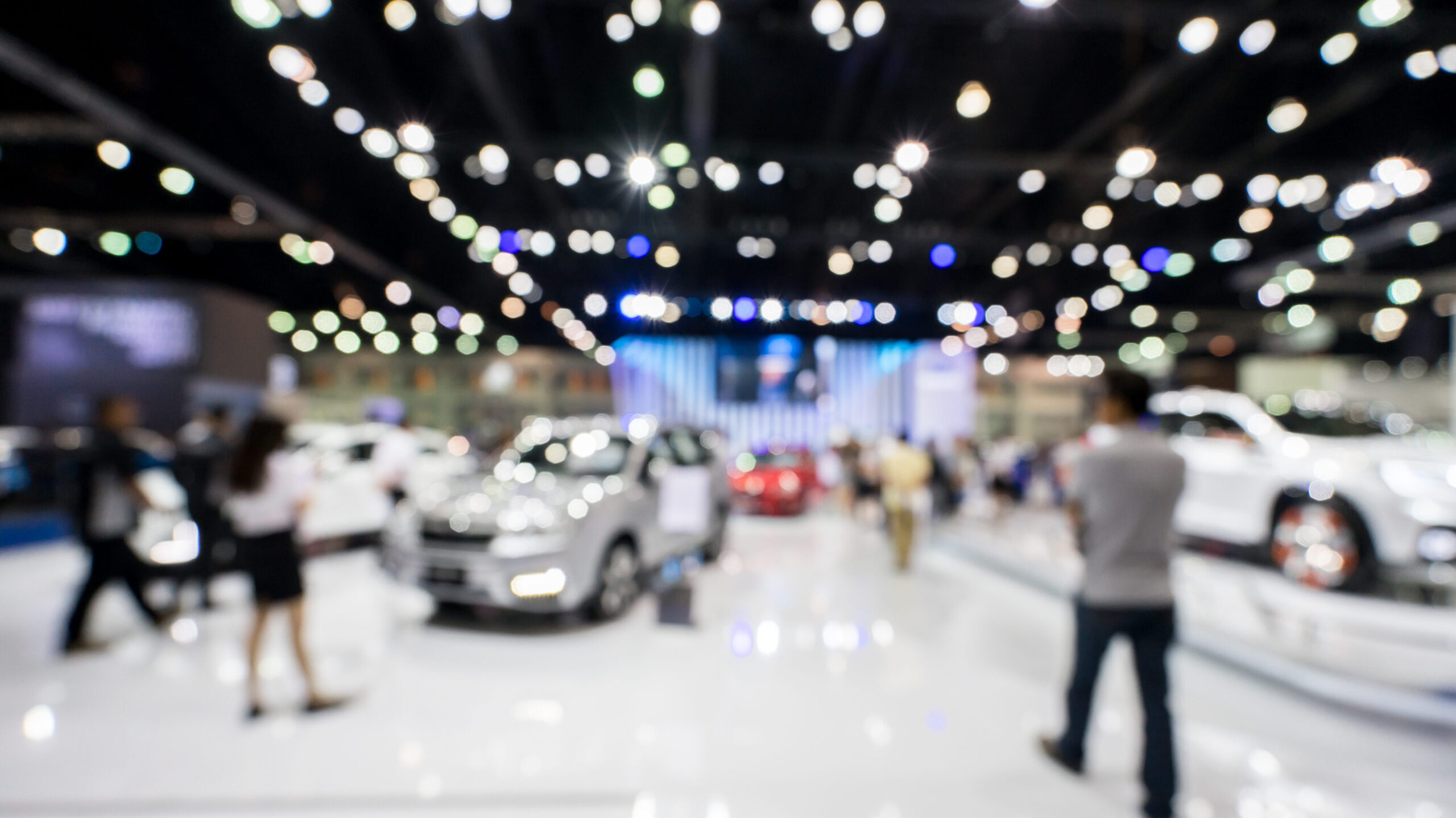 blur photo of motor show, car show room